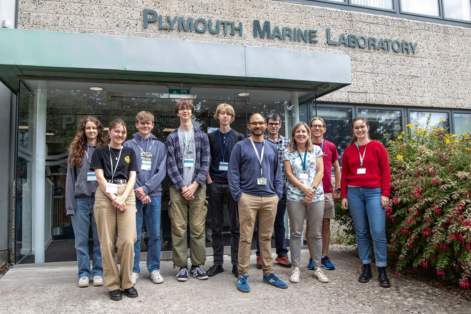 Group photo of students and staff outside the Plymouth Marine Laboratory building